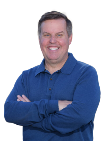 Professional headshot of John McCann smiling with arms folded across chest